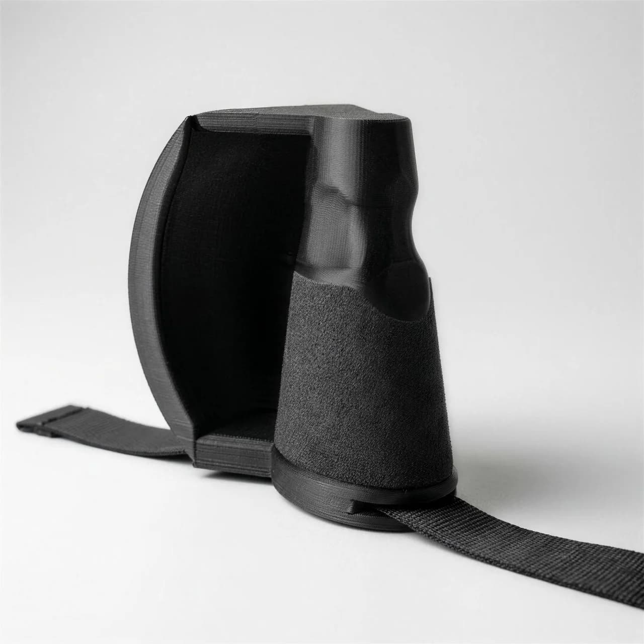 Ulnar Max training handle with textured cone grip inside its curved hand guard, strap threaded through the base
