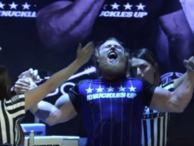 Cody Wood celebrating a victory at Knuckles Up, arms raised